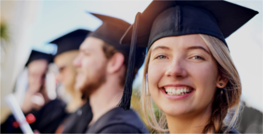Smiling young woman graduating high school